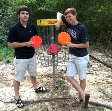 Jack Glosson and Jake Epperson (left to right) show their support for frisbee golf. The two have planned to host a frisbee golf tournament for their SIS project on Sunday, November 16.