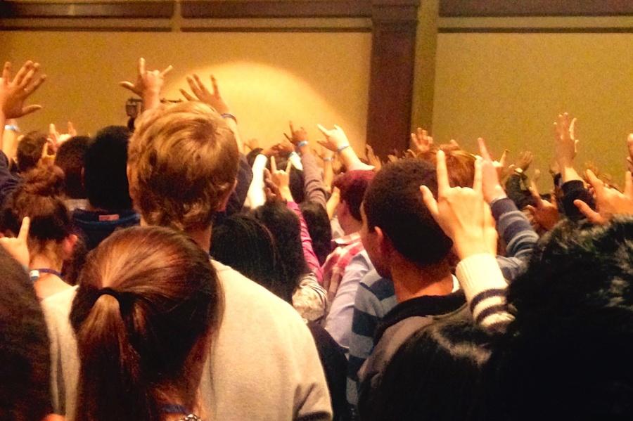High school students attend the Student Diversity Leadership Conference and hold up the sign for love. The Conference focused on expanding student diversity in independent schools.