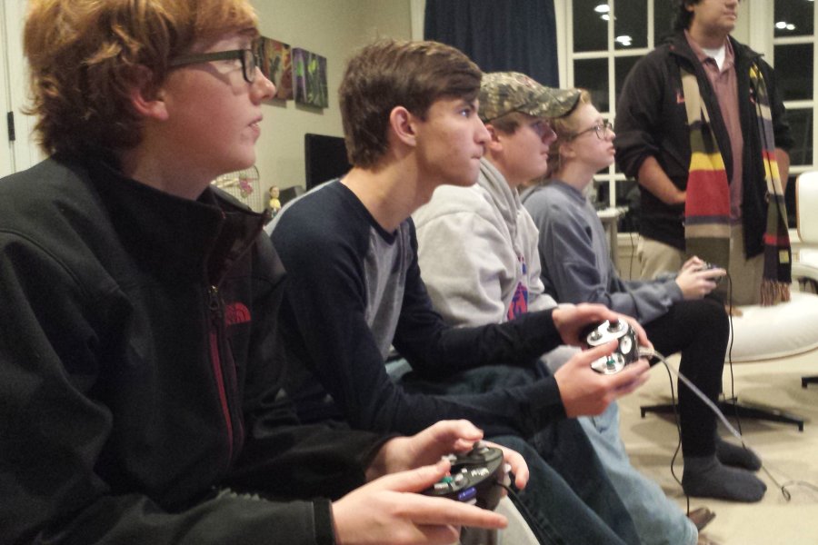 Juniors play Super Smash Bros for WiiU. The game has broken sales records and doubled sales of the WiiU.