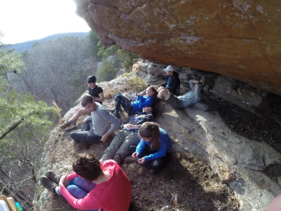 The students on the Ozarks trip enjoy spending time in the cliff-side cave before dinner time.