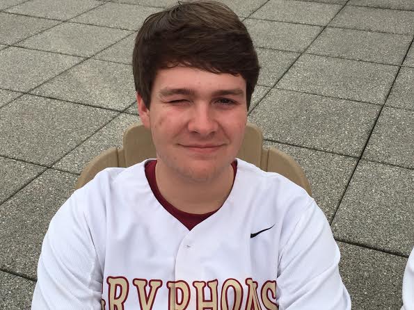 Senior Jack Glosson wears his baseball jersey while enjoying a nice day on the library deck. Glosson has been a student at St. Georges since sixth grade. 