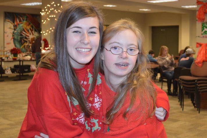 Students enjoy the Best Buddies Christmas Party. The Tacky Sweater Party was held at St. Georges.