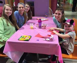 Junior Frances Gatlin, Francesca Healy, sophomore Emily Persons, and junior Keely Cox creates Valentines Day cards with Ronald McDonald house residents. The Alis Way Club volunteers frequently at the Ronald McDonald House. 