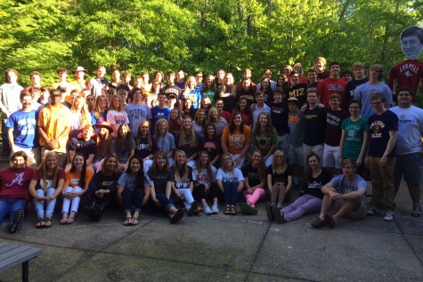 Seniors of the Class of 2015 pose in shirts of the colleges they will be attending in the fall. The graduation ceremony is Saturday, May 17.