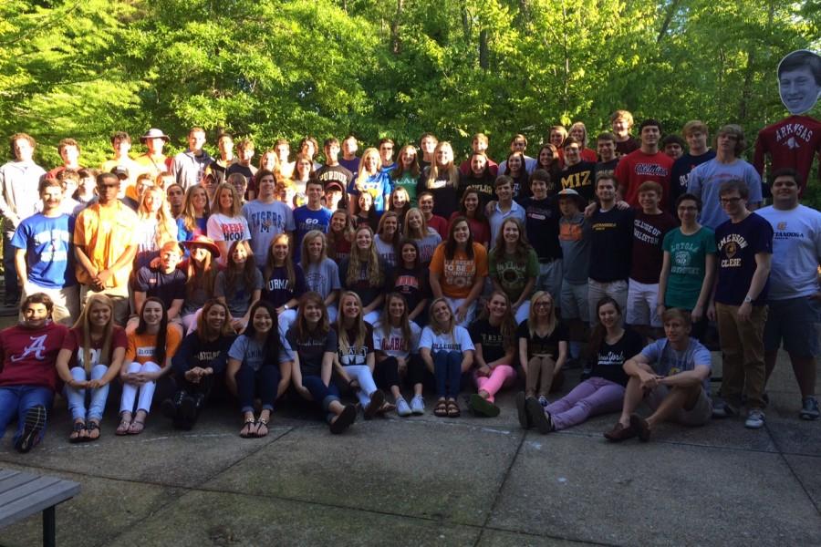 Seniors+of+the+Class+of+2015+pose+in+shirts+of+the+colleges+they+will+be+attending+in+the+fall.+The+graduation+ceremony+is+Saturday%2C+May+17.