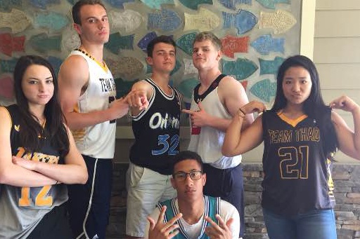 Maria Karmer, Justin Wertner, Logan Parsons, Justin Scott, Griffin Brown and Sarah Moon take a squad picture in their jerseys. All seniors participated in the scavenger hunt.