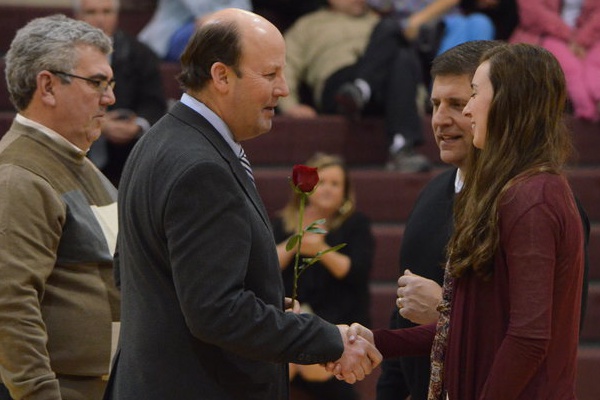 Mr. Taylor shakes hands with senior Lexie Marotta at senior night. This was Mr. Taylors final year at St. Georges.