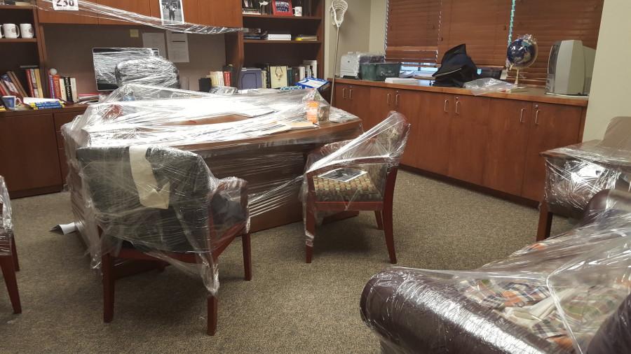 Seniors saran-wrap the furniture in Mr. Morris office. The prank took place on Thursday, May 14.