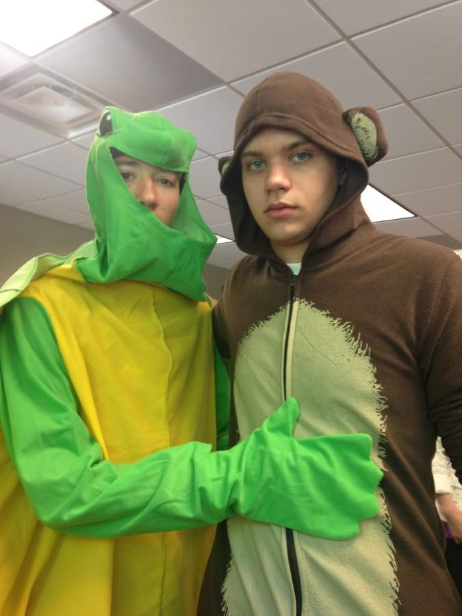 Vasili Doan and Chris DiNicolantonio side hug for a picture in their onesies. They wore turtle and monkey costumes to keep with their teams animal theme.