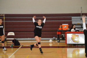 Roxanna Wood gets ready to spike the ball after it was set by another teammate. Wood has been playing on the varsity team since eighth grade.