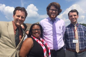 New teachers (from left to right) Mr. Jason Hills, Ms. Jessica Hardy, Mr. Sam Abrams and Mr. Jordan Wells pose for a picture in front of the school during the first fire drill of the school year. These four teachers came to St. Georges from different schools and different states.
