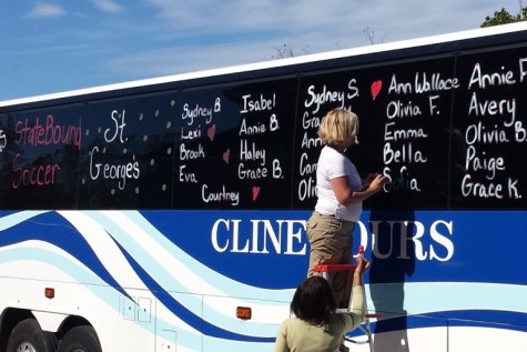 Parents of the soccer team decorate the bus for the state tournament. Students left for the state tournament in Murfreesboro on Thursday, Oct. 29.