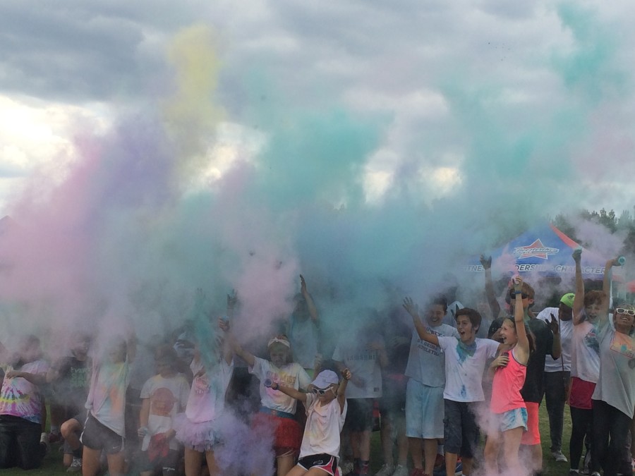 Students are awash in a cloud of pigments. The more pledges a student got, the more color they received.