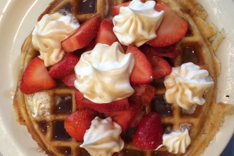 Laura McDowell orders a waffle with strawberries and whipped cream. There were waffles of every style on the menu.