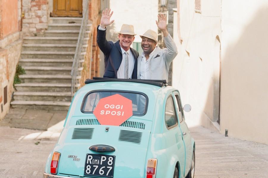 Mr. Dennis Darling and his husband, Mr. Bryan Darling, pose the morning of their wedding in a car with a sign that reads “Just Married” in Italian. Their wedding was held last summer in Italy.
