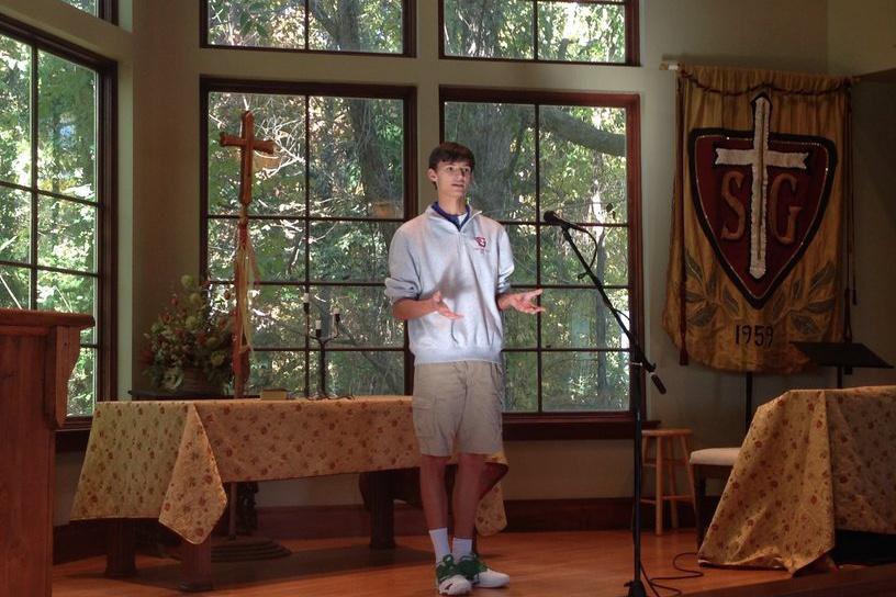 Senior Carter Burgess performs his poem in front of judges in the Agape Chapel. Burgess, along with three other St. Georges students, will continue on to the next round of the Grizzlies Poetry Slam Competition.