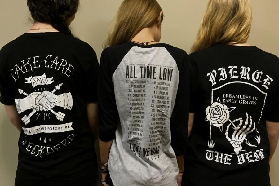 Senior Sutton Hewitt, sophomore Ellie Franklin and junior Anna Darty are photographed in their favorite band shirt. They listed their favorite bands and songs in the article. 
