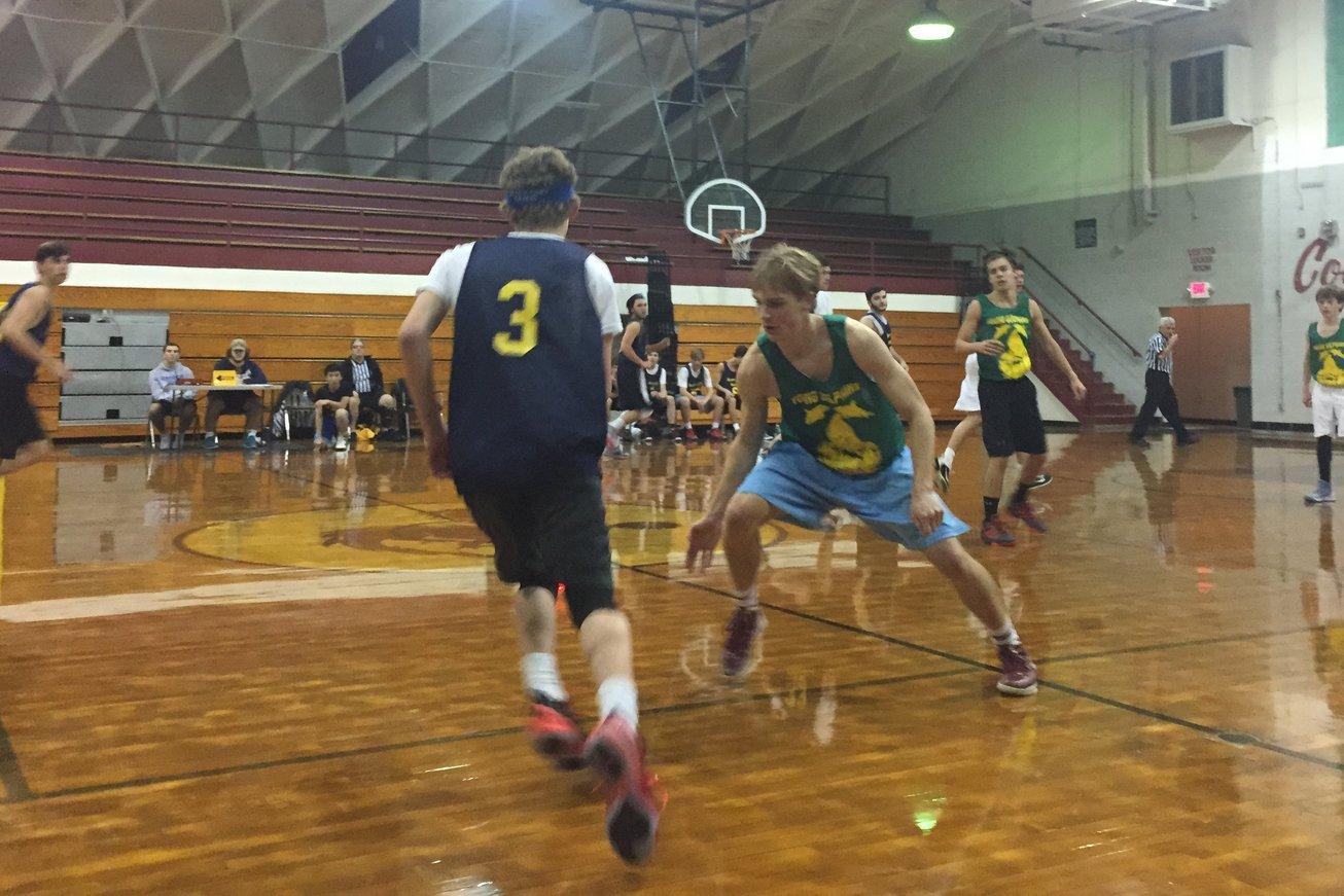 Junior Bayard anderson goes for a steal in their game against Bluff City Blues. The Young Dolphins won their game 33-24 on Dec. 2.