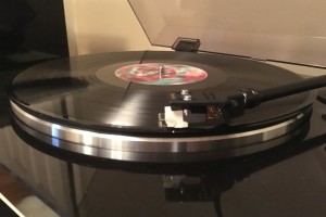 A record player plays new music from Coldplay. Coldplay, G-Eazy and Kid Cudi all released new albums within the month of December.