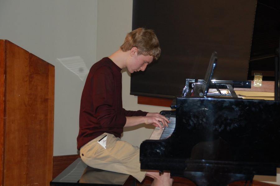 Sophomore Lucas Williamson plays the piano. Williamson performed after the midday break for coding. 