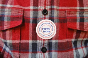 An I Voted Today sticker is proudly worn. Some people, like the person in this photograph, have chosen to wear red and blue on election days to represent the two political parties.
