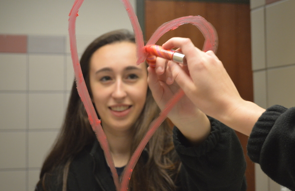 Sophomore Annie Murff displays her self-confidence by drawing a heart on the mirror in the bathroom. Murff plans to spend her valentines day with her friends and family.