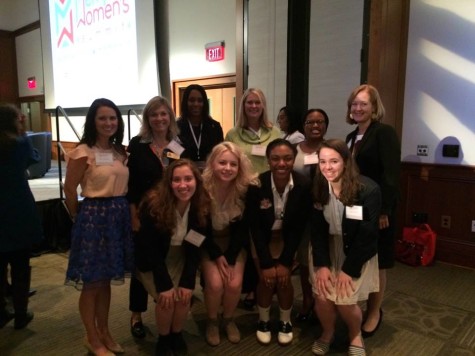 Juniors Katie Boyle, Chloe Booth, Essence Davis and Miriam Brown pose with members of the Board of Trustees at the Memphis Womens Summit. The Summit was put on by the Junior League of Memphis.