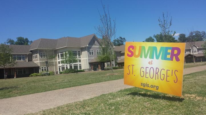 A+sign+for+the+Summer+at+St.+George%E2%80%99s+program+stands+on+the+lawn+of+the+Collierville+Campus.+the+sign+was+advertising+the+new+summer+programs.