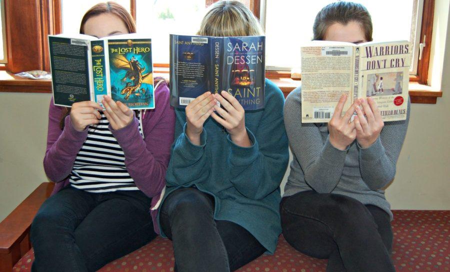 Juniors Laura McDowell, Elle Vaughn and Britney Pepper read during their free period. For her suggestions, Brown explored options from fantasy to memoir.