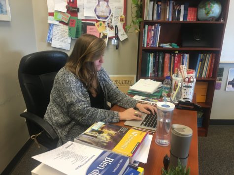 Ms. Dani Douglass works in her new upper school classroom. Several middle school teachers made the move to upper school this year.