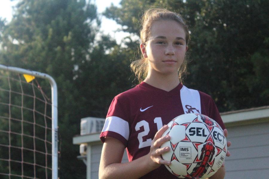 Eighth grader Livi Tanzer poses on the soccer field. Tanzer joined the varsity girls soccer team this year.