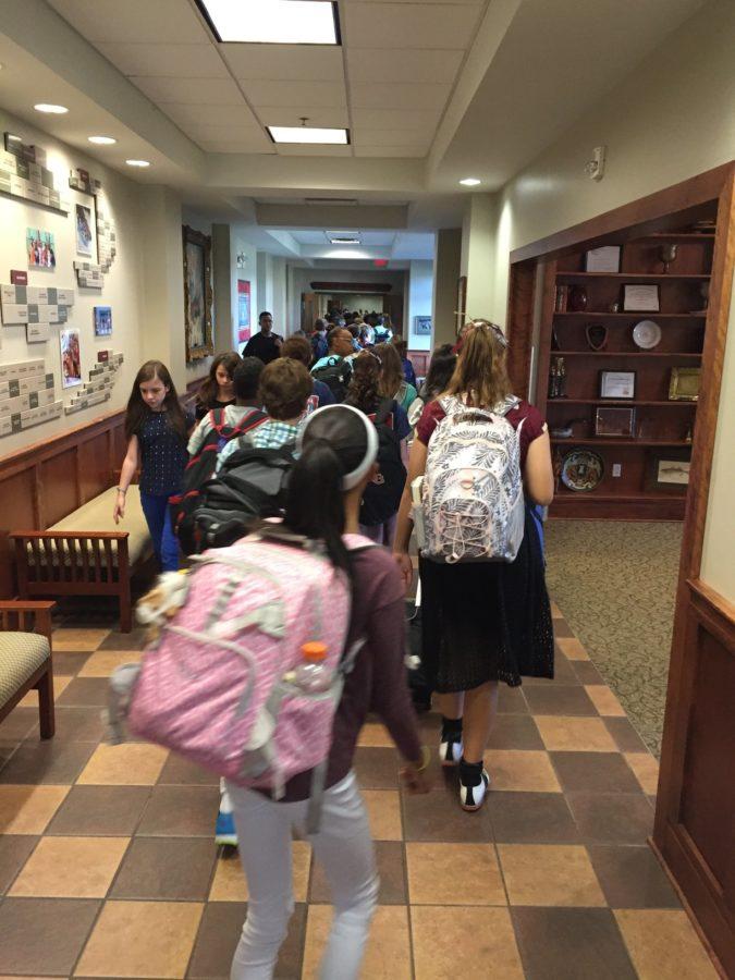 Sixth grade students head to their classes. Sixty eight sixth graders started at the Collierville campus this year.
