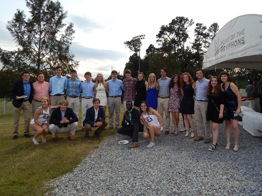 Seniors pose together at the senior/parent tailgate. The tailgate, which all families were invited to, highlighted the Class of 2017.