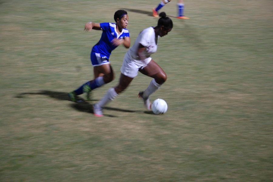 A Harding soccer player chases after senior Sydney Brown as she powers towards the goal. The intense game concluded with the St. George’s varsity soccer team winning 10-1.