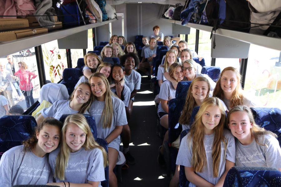 The team poses for a photo in the bus. The varsity soccer team won Friday, Oct. 21, which secured their spot in the state semifinals.