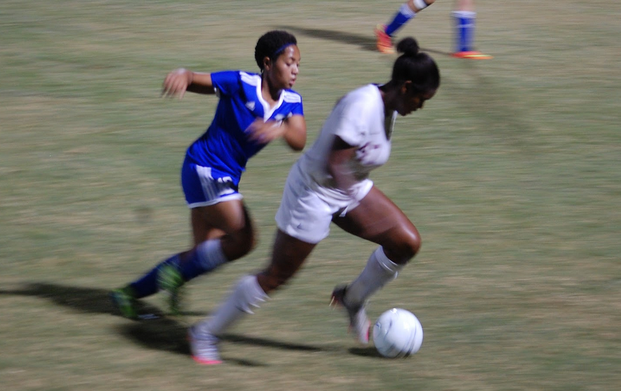 A Harding soccer player chases after senior Sydney Brown as she powers towards the goal. The intense game concluded with the St. George’s varsity soccer team winning 10-1.