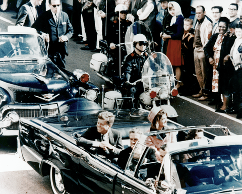 John F. Kennedy rides in a motorcade in this famous photograph. Watching the film “JFK” had a significant impact on reporter Will Brown.