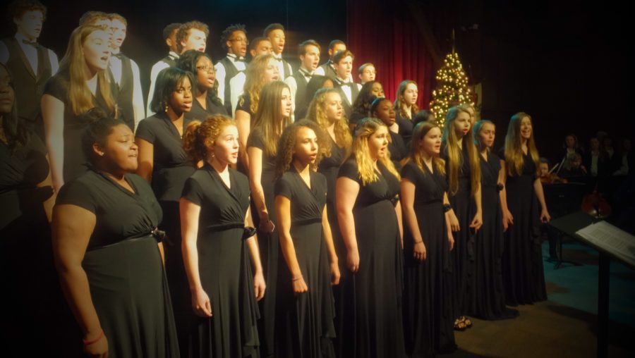Upper+school+choir+students+sing+at+the+Middle+and+Upper+School+Band+and+Choir+Christmas+Concert.+The+concert+was+held+on+Dec.+5.+