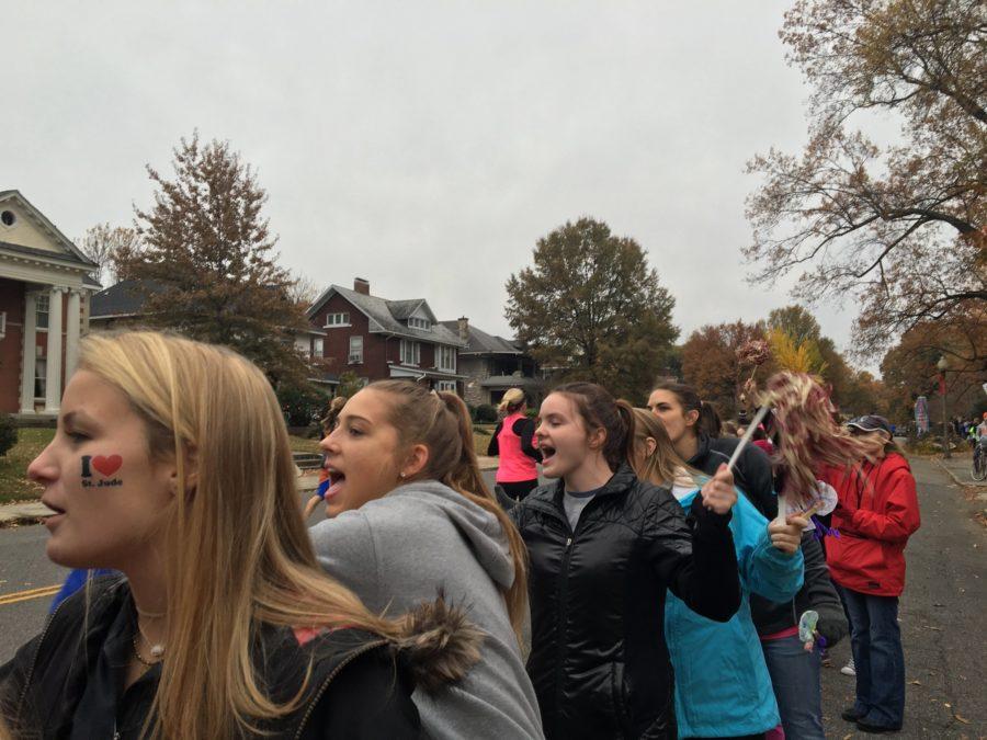 St. Georges alumni Shane Horton, Avery Whitehead and Maggie Glossom cheer on runners during last years race. Next years St. Jude Memphis Marathon Weekend will be held over December 1, 2018. 