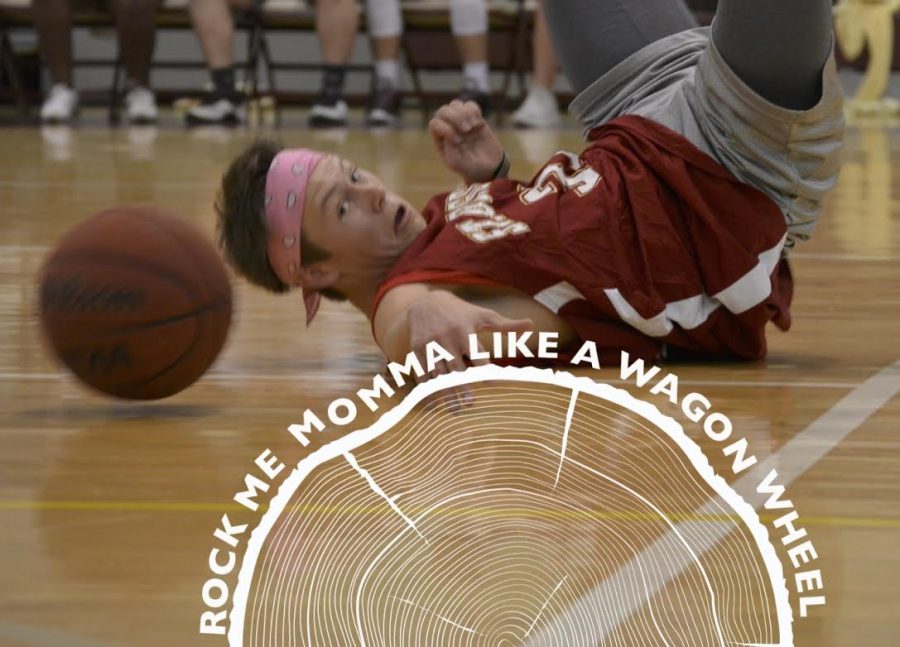 Junior Griffin Hancock dives for the basketball. The yearbook graciously shared a sneak peak of the basketball layout. 