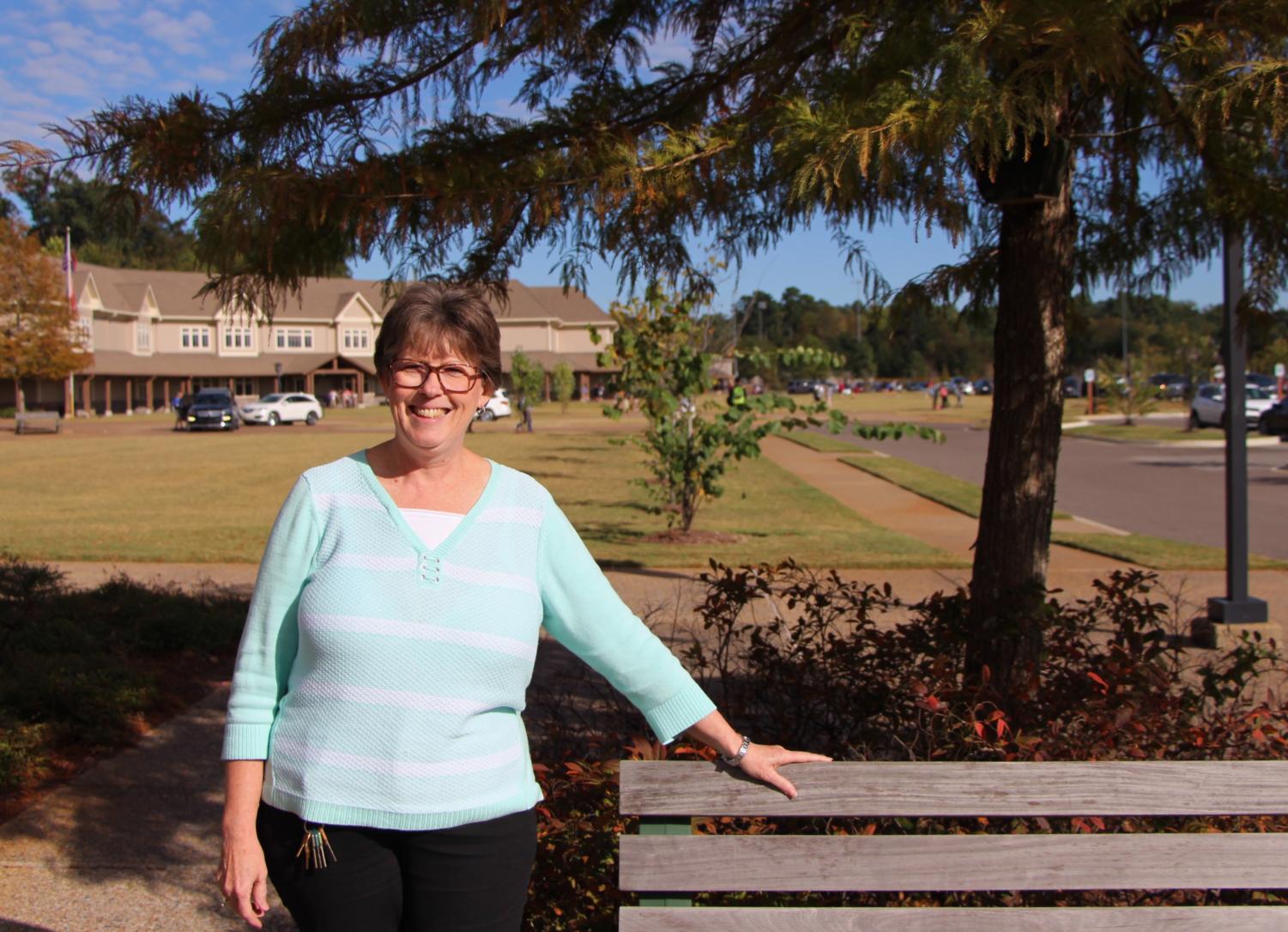 Ms. Dean smiles in a posed picture outside the school. Ms. Dean loves challenges and is excited to begin working at St. George's.