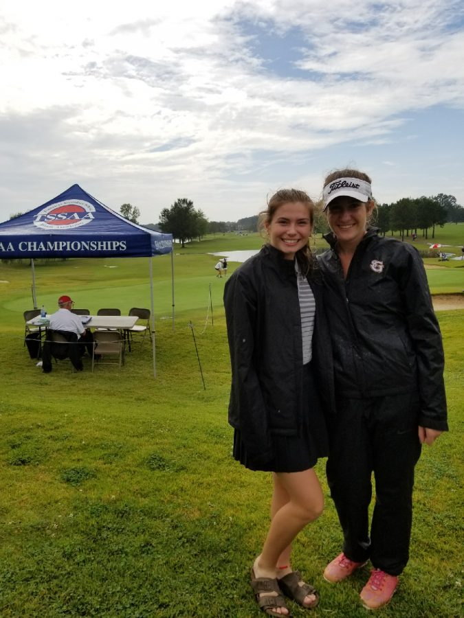 Junior+Victoria+England+%28right%29+stands+next+to+teammate+Grace+Higley+%28left%29+at+the+girls+golf+state+championship.+England+has+won+the+state+championship+twice.