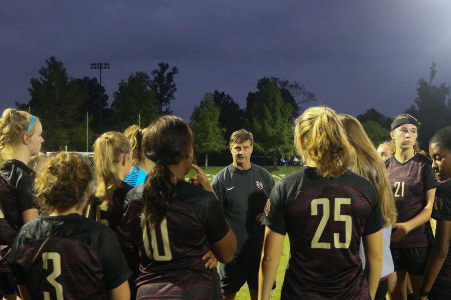 The+Lady+Gryphons+gather+together+during+a+game.+Recently%2C+the+soccer+team+has+started+to+form+traditions+that+have+brought+them+closer+together.