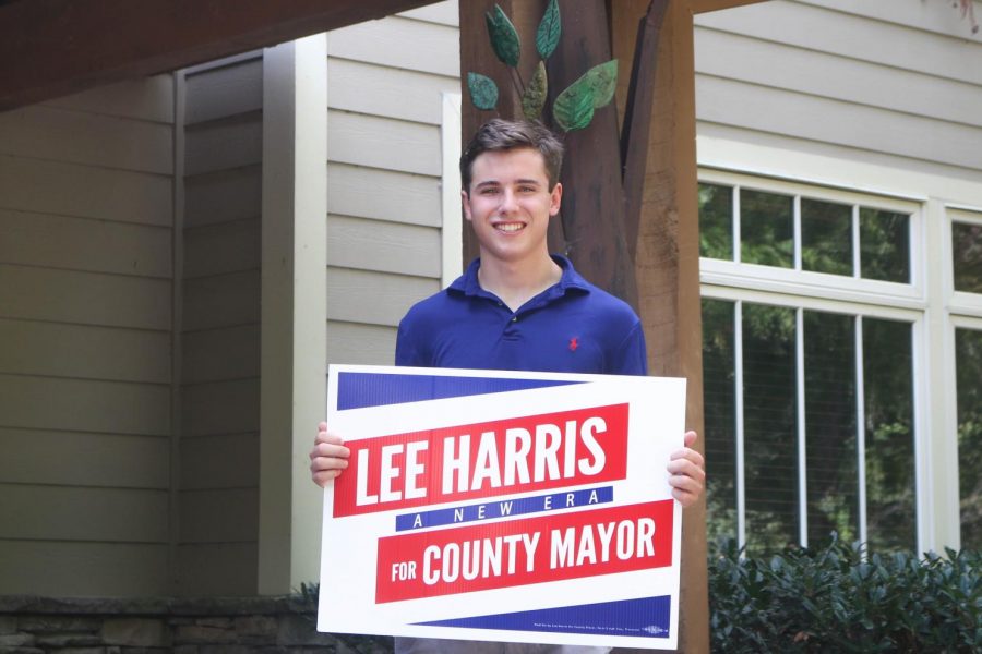 St. George’s alumnus poses with a Lee Harris sign from the recent campaign. Doucette said the experience of working on the campaign helped him learn leadership skills.