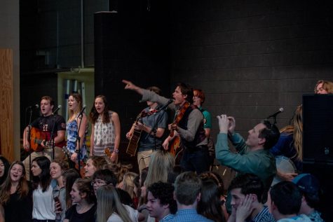 Mr. Jason Hills, Director of the Institute for Citizenship and father of Modern Music Ensemble Member, Elianna Hills, pulls out his camera to record the students performance. The crowd began to gather to the signature circle for Wagon Wheel.