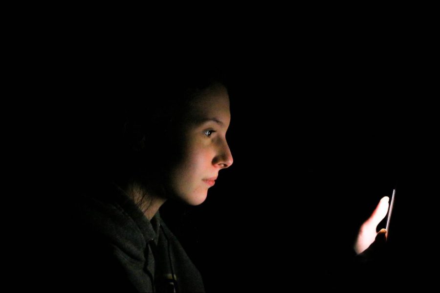 Sophomore Madeline Sisk poses for a photograph while scrolling through Snapchat on her phone.
Forty-five percent of teens say they use social media “almost constantly.”