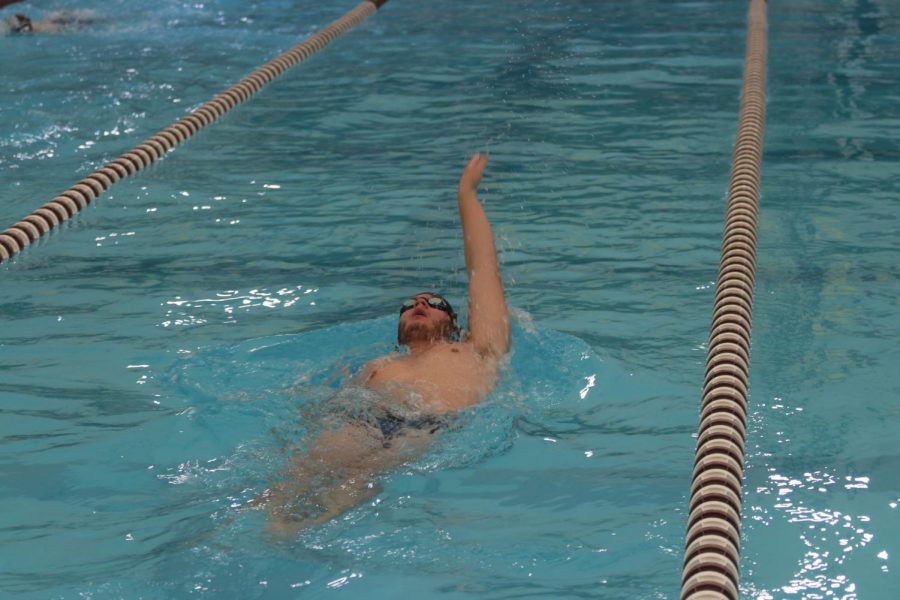 Senior%2C+Luke+Stevens%2C+working+on+backstroke+during+practice.+The+team+engages+in+time+trials+to+see+how+quickly+they+are+improving.