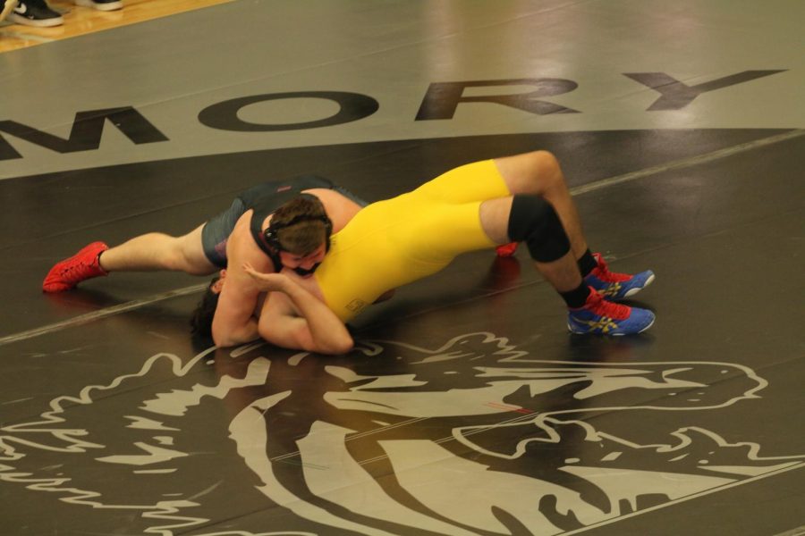 Josh Taube grapples with his opponent as he goes for a pin to win the match. This match was part of a tournament at Houston High School.