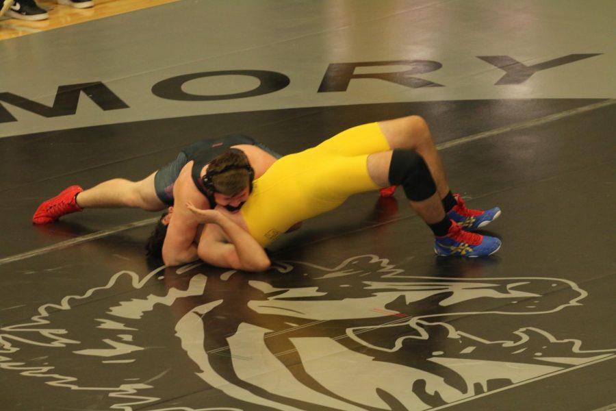 Josh+Taube+grapples+with+his+opponent+as+he+goes+for+a+pin+to+win+the+match.+This+match+was+part+of+a+tournament+at+Houston+High+School.