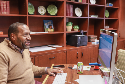 (Photo on file) Interim Head of School Mr. Timothy Gibson works at his desk during the winter of last year. Mr. Gibson has been a St. George's faculty member since 2009.